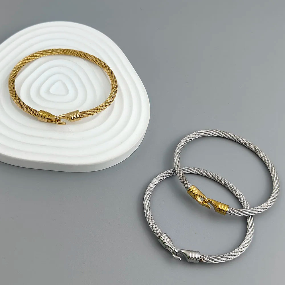 wire button pattern horseshoe gold-plated stainless steel bracelet.